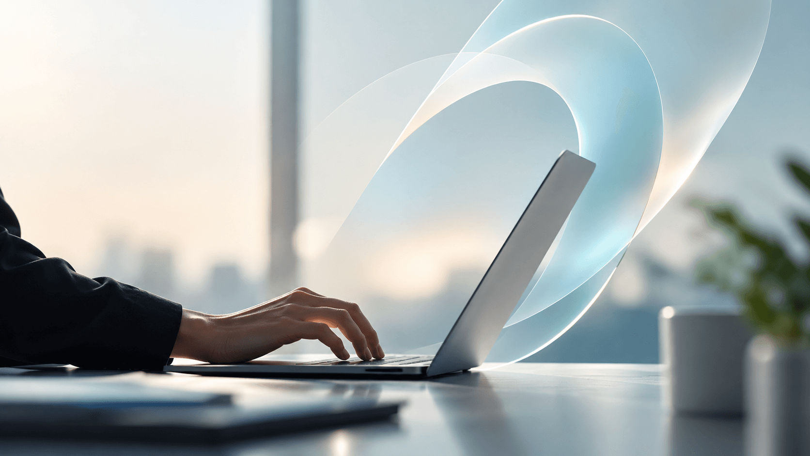 A hand typing on a laptop with an abstract translucent ribbon of light behind the screen